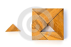 Wooden tangram puzzle in square shape wait for fulfill on white