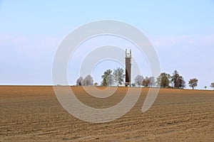 Wooden Telecommunication tower with transmitters. Cellular base station with transmitter antennas on a telecommunication tower on