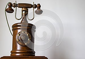 Wooden telephone on a light background