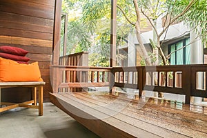 Wooden terrace for outdoor rest at deluxe bedroom in luxury hotel