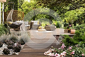 Wooden terrace surrounded by greenery