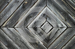 Wooden diagonal texture of boards aged old fence in the form of rhomb structure. Rhombus wood wall background