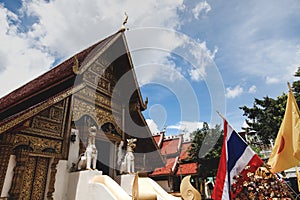 wooden thai temple with traditional hindu sculptures