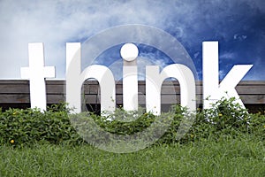 Wooden think sign over blue sky