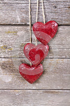 Wooden three red hearts