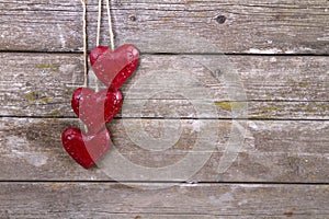 Wooden three red hearts