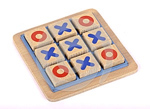 A wooden tic tac toe game