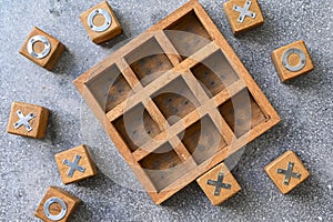 Wooden tic tac toe O X game.