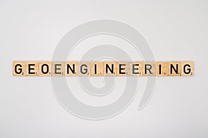 Wooden title spelling the word geoengineering isolated on a white background