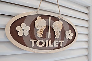 Wooden toilet sign , Cute boy and girl on White background