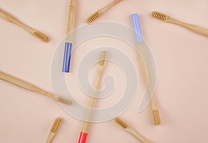 Wooden toothbrushes on beige background