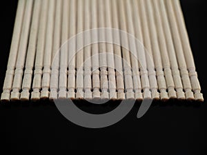 Wooden toothpicks on black background