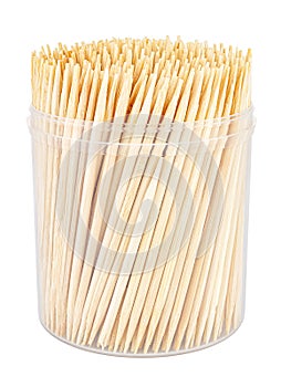 Wooden toothpicks close-up in transparent plastic cylindric box without cap isolated on white background