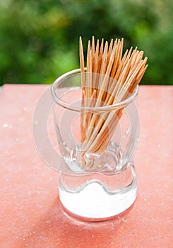 Wooden toothpicks placed in a glass container