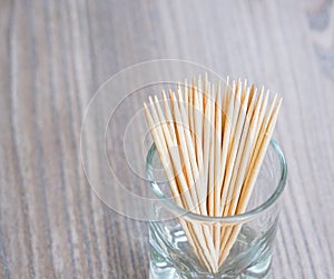 Wooden toothpicks placed in a glass container