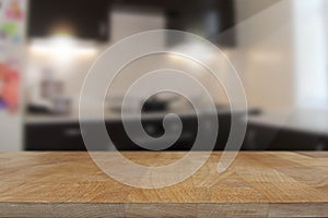 Wooden top table with blurred kitchen interior background