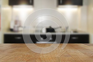 Wooden top table with blurred kitchen interior background