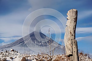 Wooden totem next to the volcano