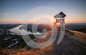 Wooden Tourist Observation Tower above a Little City with River