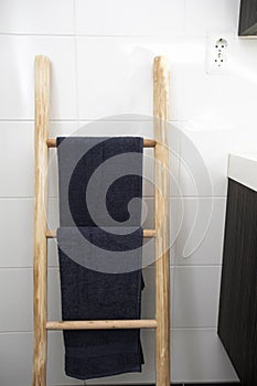 Wooden towel hanger ladder bathroom with clean towels