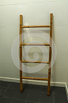 wooden towel hanger ladder bathroom on the gray floor