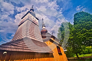 Wooden towers of Greek Catholic wooden church of St. Michael Archangel in Ladomirova