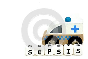 wooden toy ambulance and a word sepsis photo