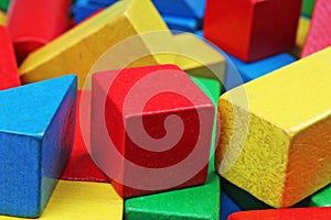 Wooden toy block background. Red, Blue, Yellow Green Wooden toy blocks on white background. Wood block texture pattern.