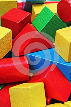 Wooden toy block background. Red, Blue, Yellow Green Wooden toy blocks on white background. Wood block texture pattern.