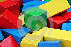 Wooden toy block background. Red, Blue, Yellow Green Wooden toy blocks on white background. Wood block texture pattern.