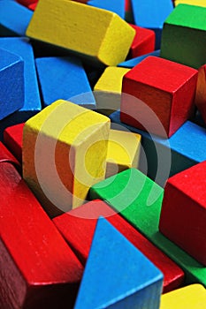 Wooden toy blocks background. Red, Blue, Yellow Green Wooden toy blocks on white background. Wood block texture pattern.