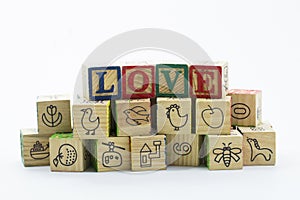 Wooden toy blocks spelling I love you isolated on a white background