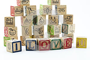 Wooden toy blocks spelling I love you isolated on a white background