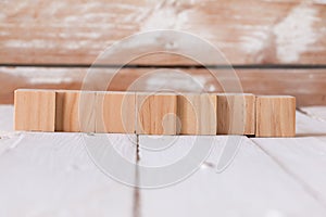 Wooden toy blocks on wooden background