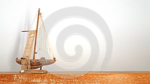 Wooden toy boat ship on wood board