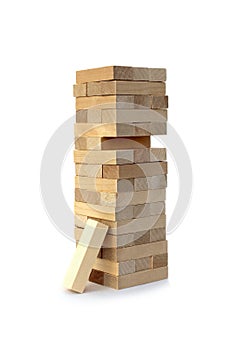 Wooden toy for building a tower with small blocks.