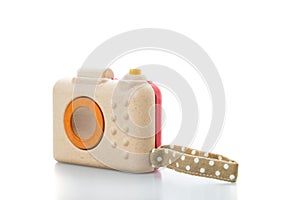 wooden toy camera on white background