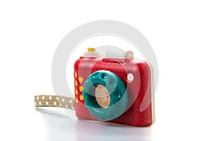 wooden toy camera on white background