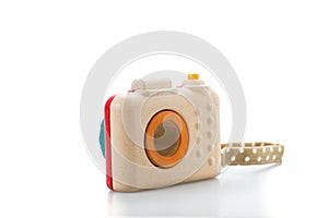 wooden toy camera on white background