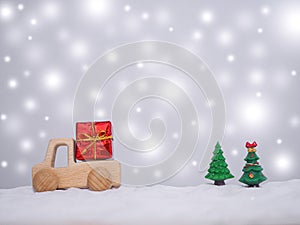 Wooden toy car, Gift box and Christmas tree with shiny light for Christmas and New Year holidays background, Winter season,