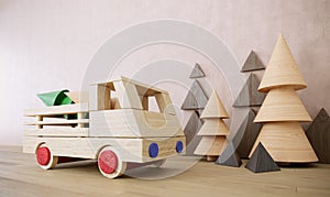 Wooden toy car with pine trees christmas holiday background photo