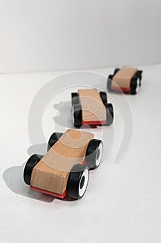 Wooden toy cars isolated on white background