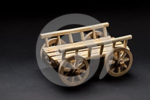 Wooden Toy Cart on a dark background