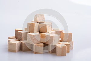 Wooden toy cubes as educational game object on white background