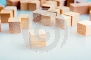 Wooden toy cubes as  educational game object on white background