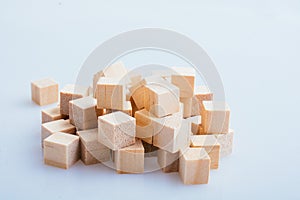 Wooden toy cubes as  educational game object on white background