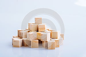 Wooden toy cubes as  educational game object on white background