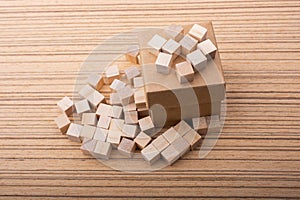 Wooden toy cubes as  educational game object on wooden background