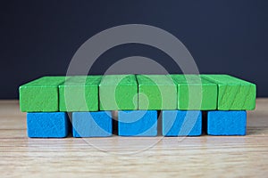 Wooden toy cubes on a brown wooden background