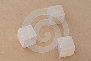 Wooden toy cubes on a light background. Business and design concept, Symbol of leadership